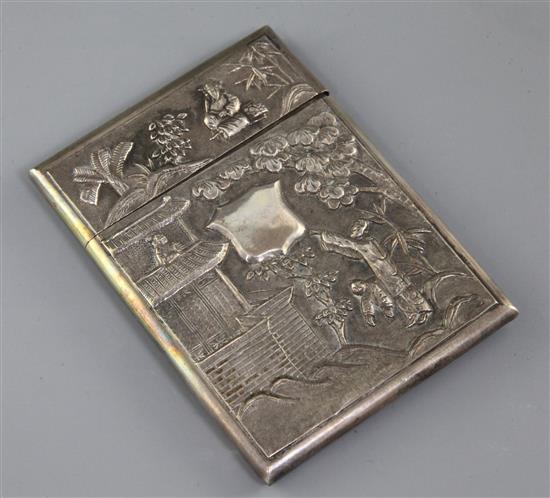 An early 20th century Chinese silver card case with embossed decoration and vacant cartouche, 10.4cm.
